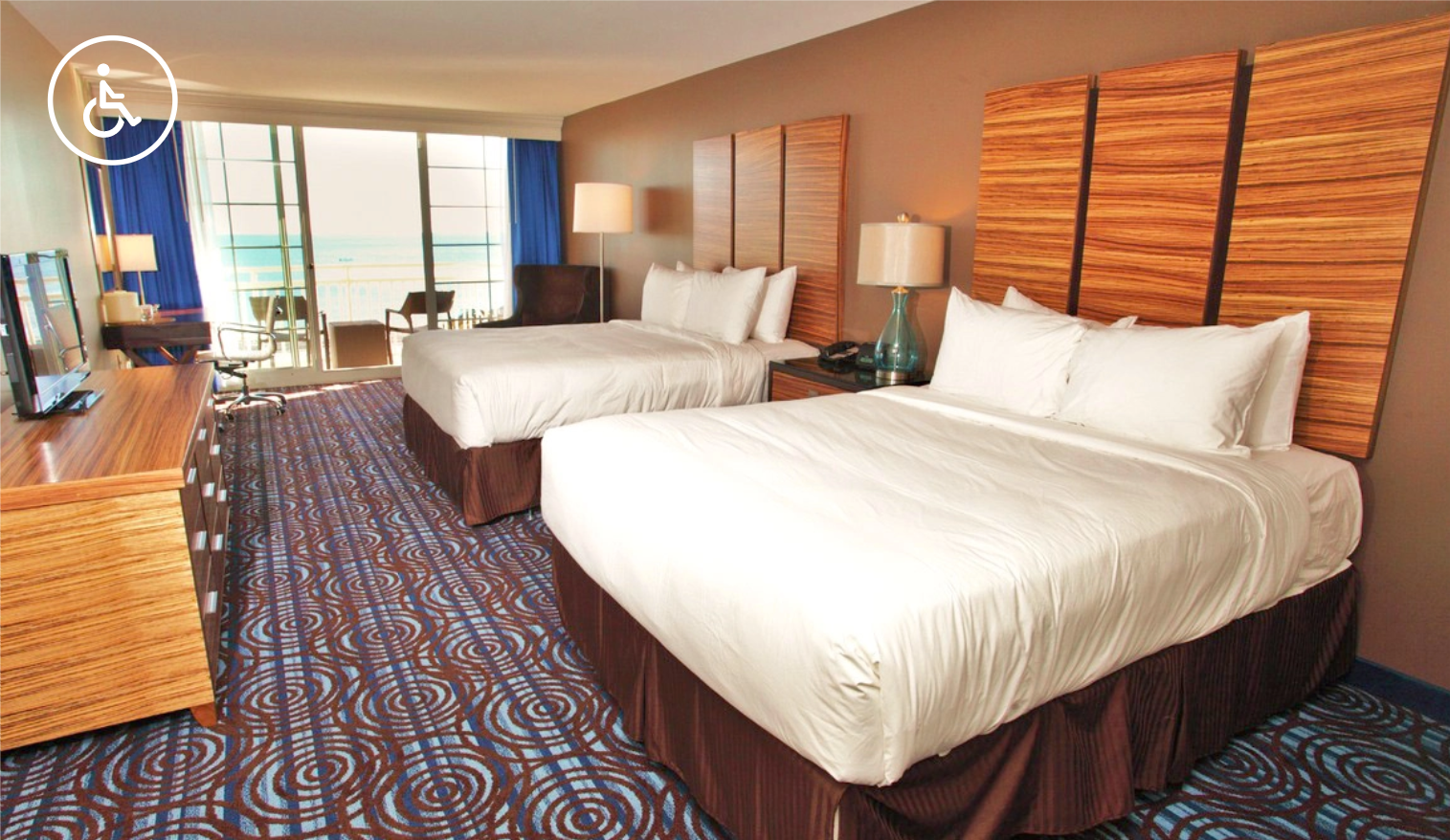 ADA-compliant hotel room with two queen beds and ocean view