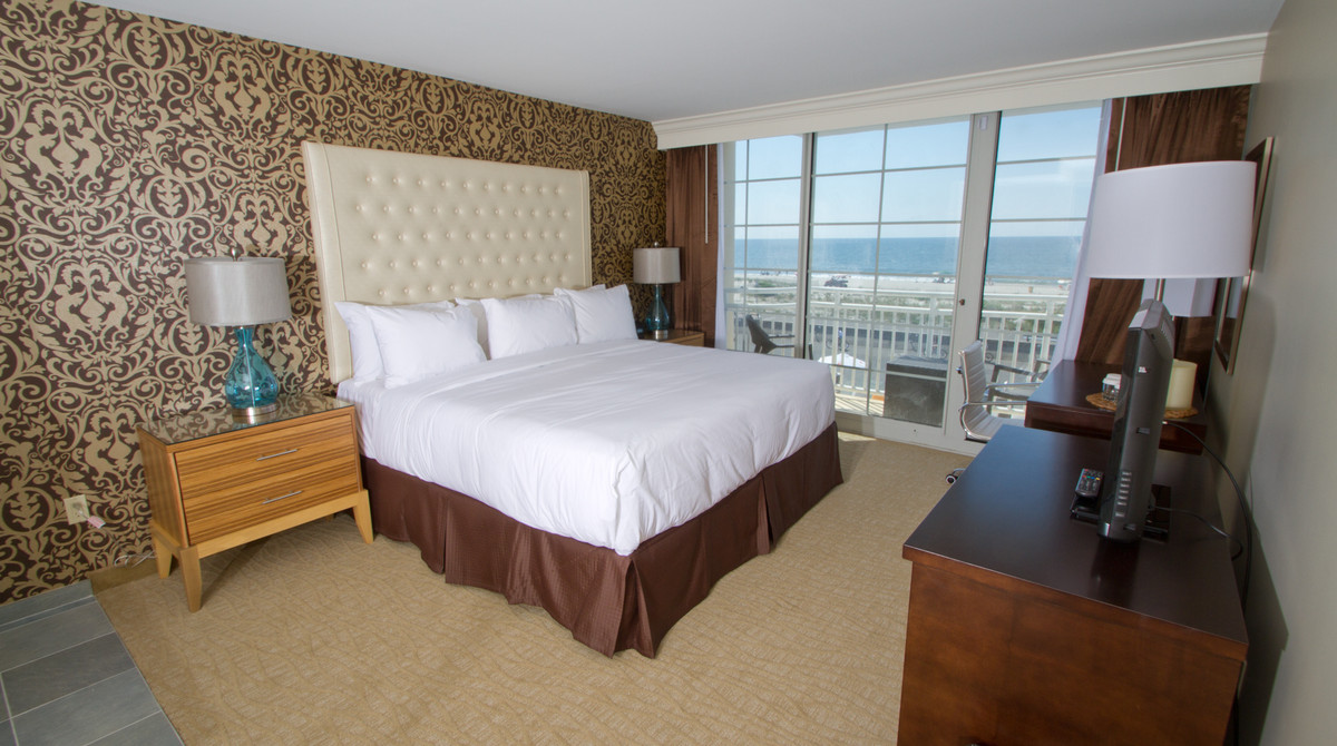 Single king bed in full ocean view suite