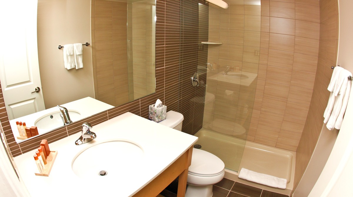 Bathroom and walk-in shower in Ocean Club Hotel rooms in Cape May, NJ