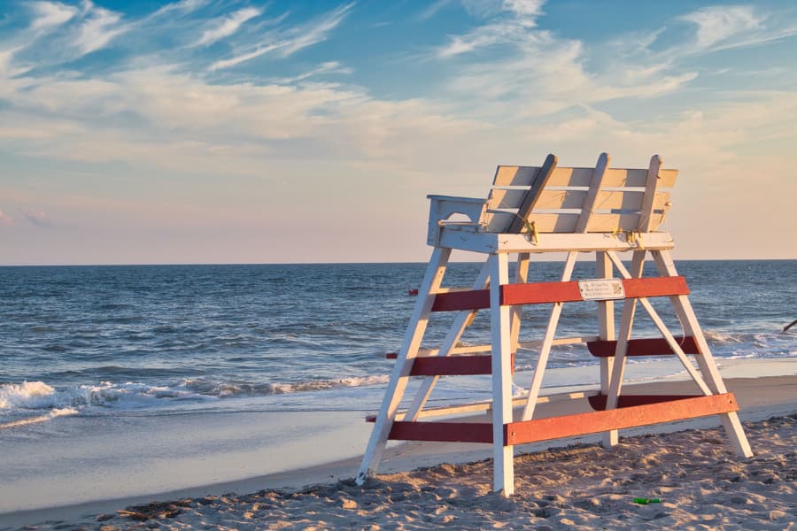 Lifeguard chair facing the ocean on sandy beach in Cape May, NJ