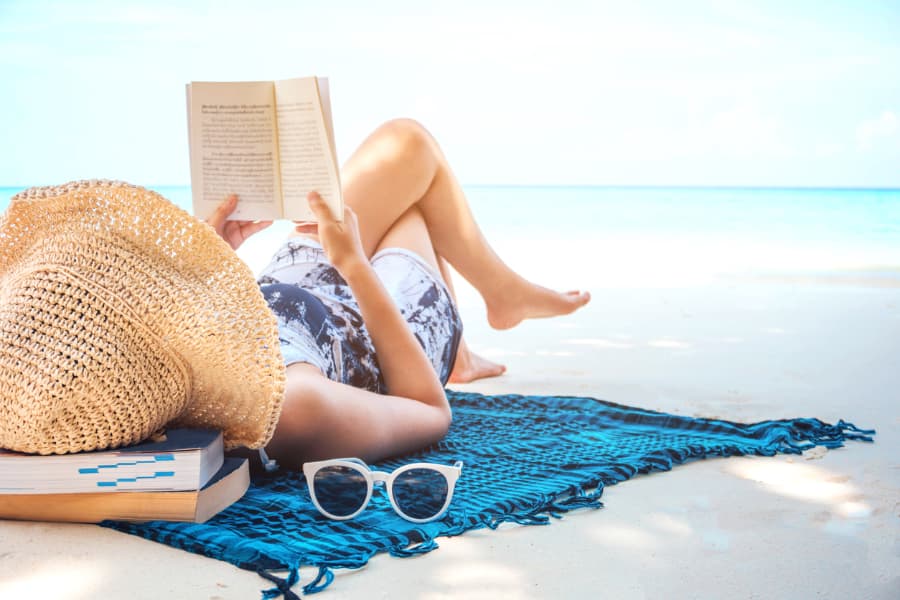 Reading a book on the beach