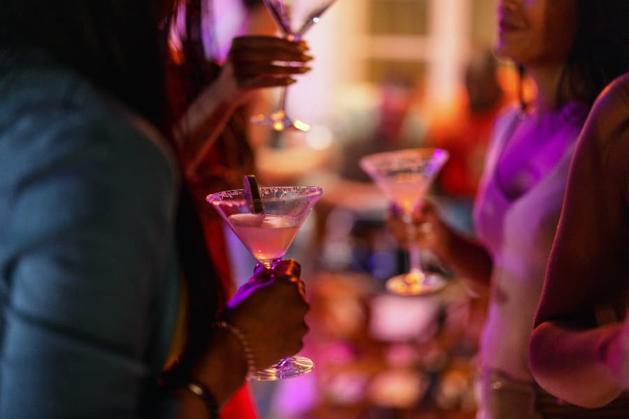 Patrons with martinis in hands