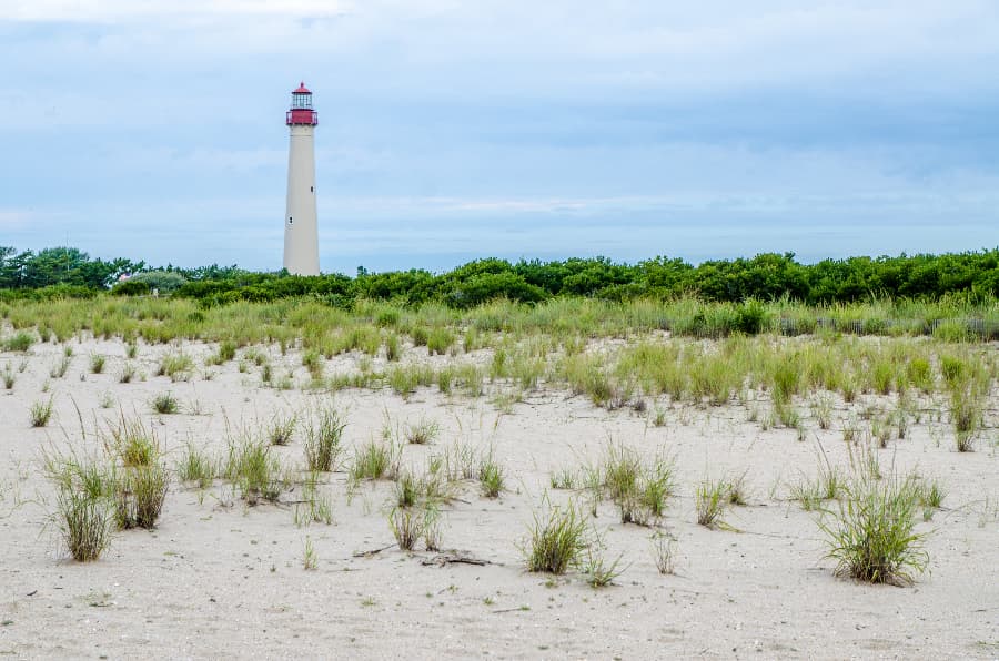 Cape may lighthouse with beach in foreground