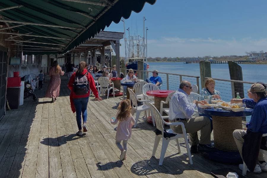 People dining on the water at Cape May restaurant